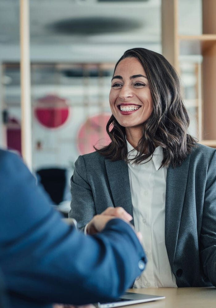 Real estate investment professionals discussing REIT strategy in a meeting