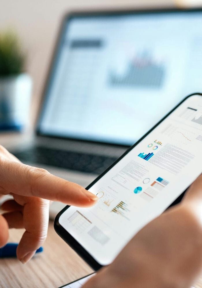 Investor reviewing REIT performance on a mobile dashboard